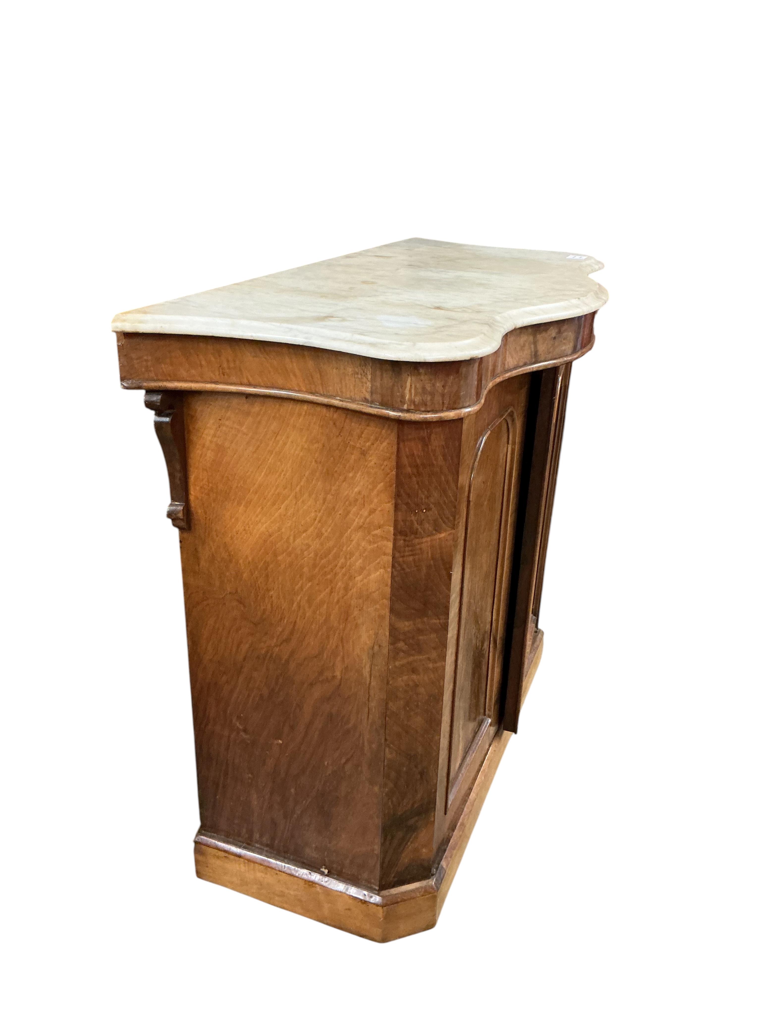 A Victorian walnut serpentine front marble top side cabinet, width 99cm, depth 46cm, height 87cm